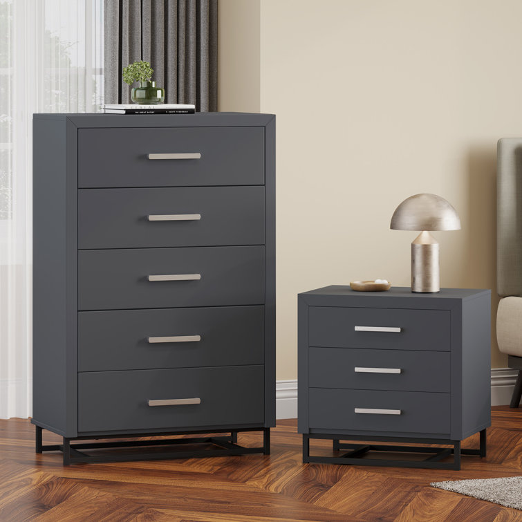 Black dresser with store matching nightstand